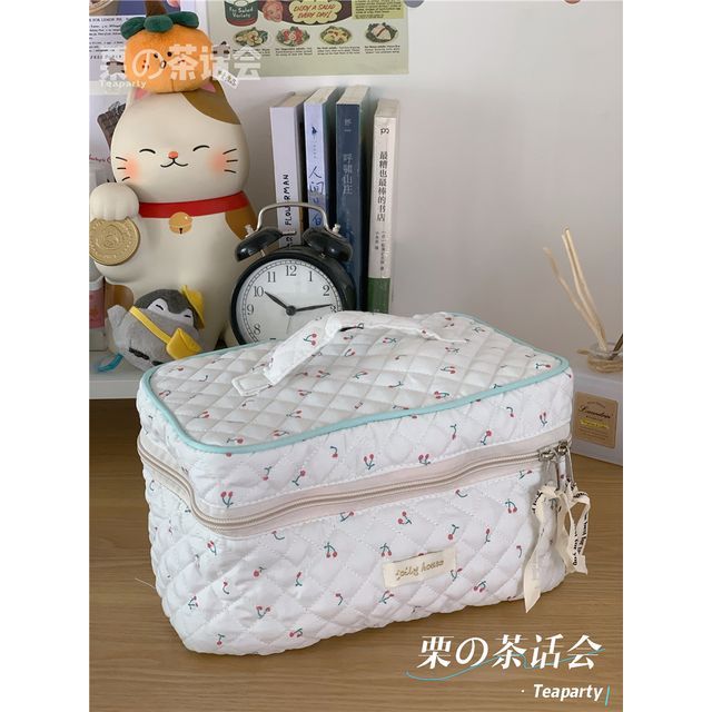 Trousse de maquillage matelassée à motifs