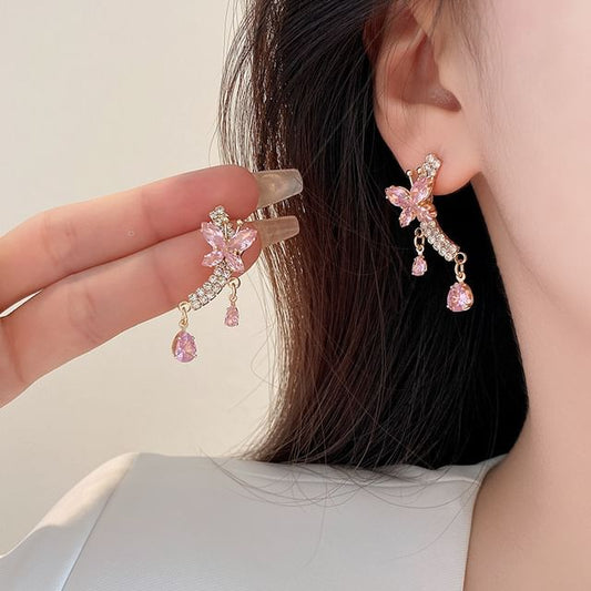 Boucle d'oreille pendante papillon en strass