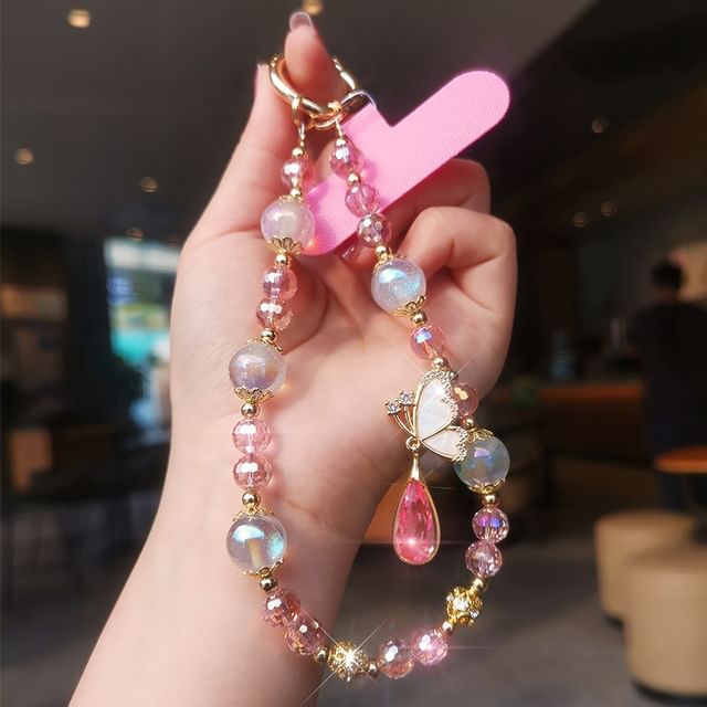 Dragonne de téléphone en faux cristal avec coussinet pour cordon