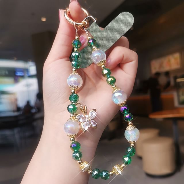 Dragonne de téléphone en faux cristal avec coussinet pour cordon