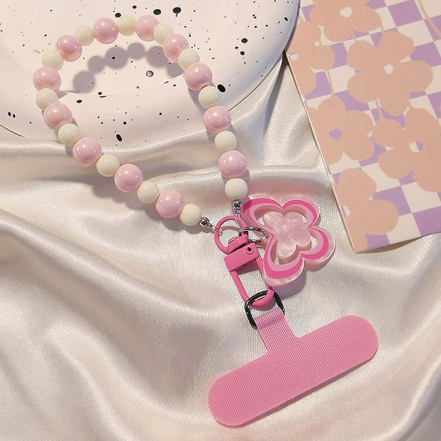 Dragonne de téléphone en perles papillon avec coussinet de lanière