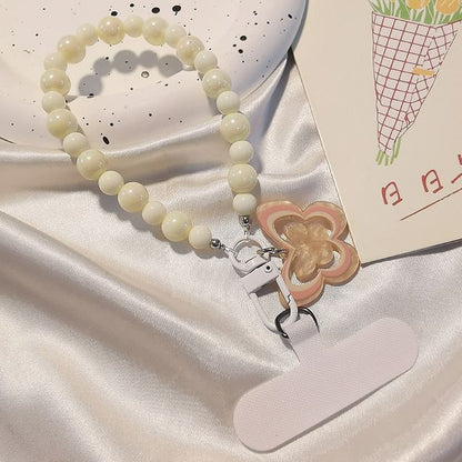 Dragonne de téléphone en perles papillon avec coussinet de lanière