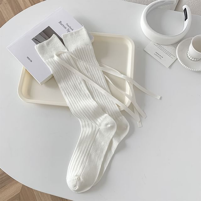 Chaussettes hautes unies à nœud