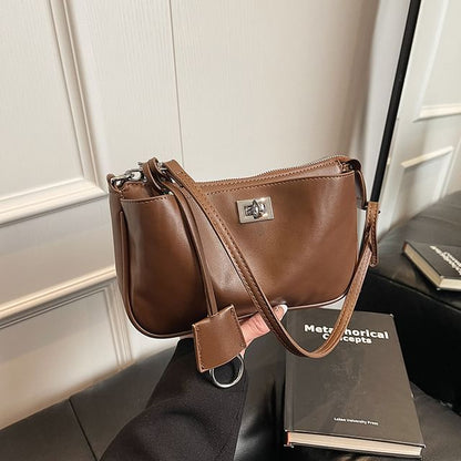 Lock Leather Twist Faux Crossbody Bag